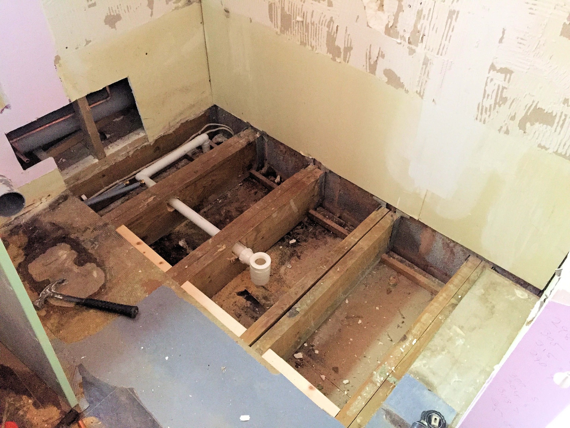 Old bathroom completely removed, hot and cold service pipes and drainage repositioned to suit new layout.