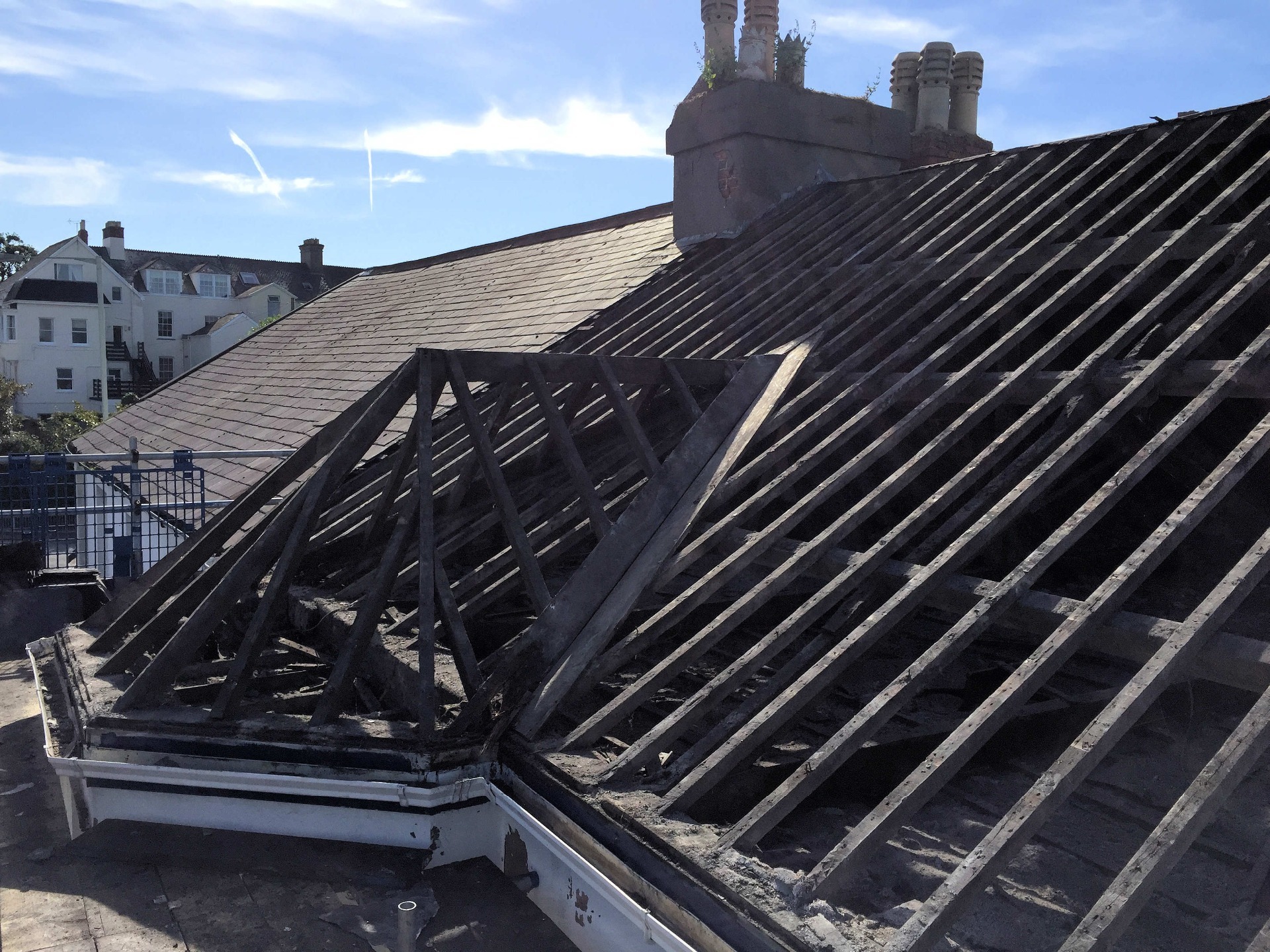 Roof stripped back to original rafters, saving as many original slates as possible for re-use. All damaged timbers were replaced at this point by MJS Building Maintenance Ltd.