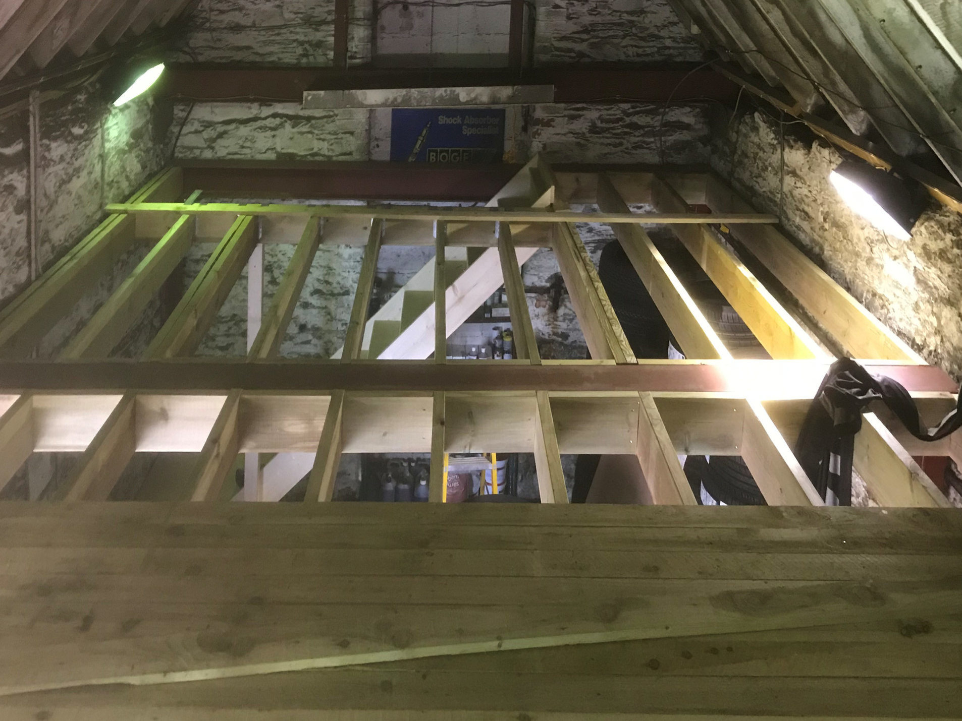 Mezzanine floor, 4x1 timber laid over joists and fixed.