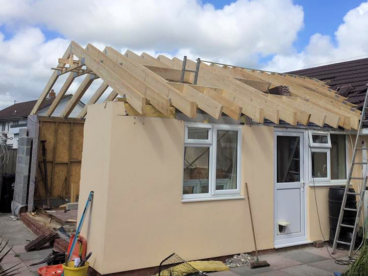 Roof trusses installed, trimmed for velux windows, braces installed.