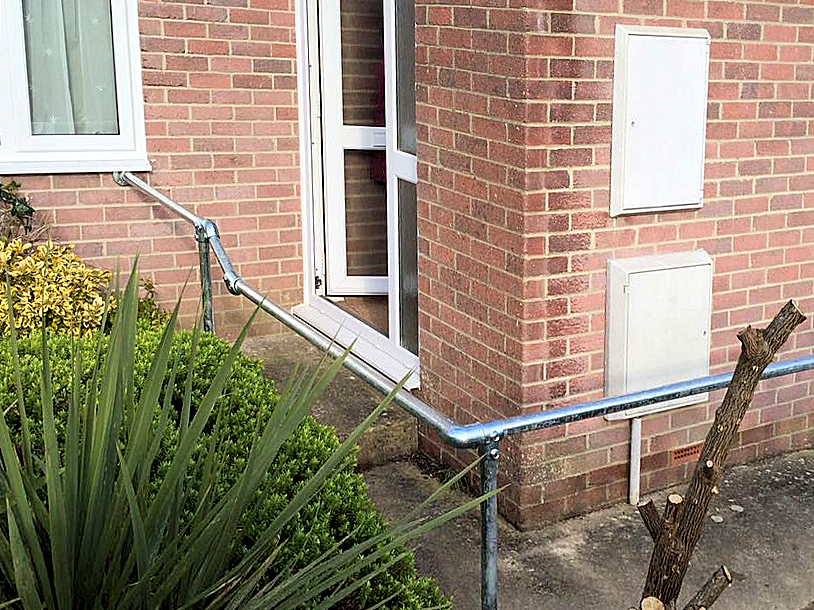 Key clamp handrail installation for a domestic property to aid ease of access along front path up to front door entrance. Barnstaple North Devon