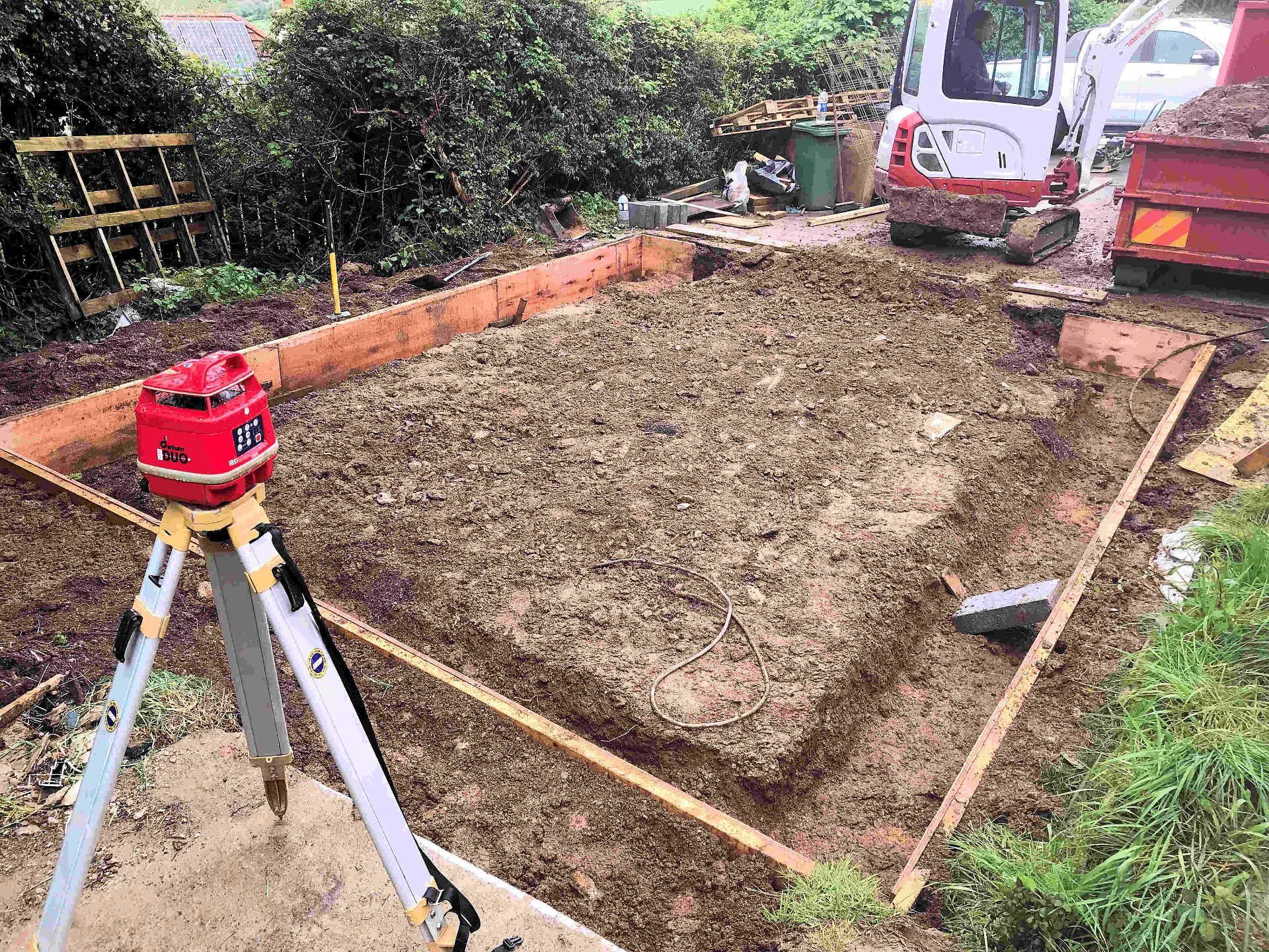 Old garage removed, site leveled graded and hardcore layed. External shuttering installed using laser level. Barnstaple North Devon