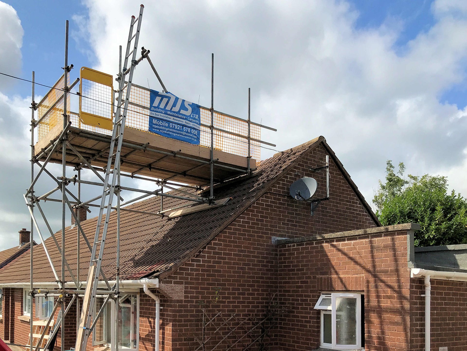 Scaffold erected to enable removal of complete chimney and subsequent repairs to roof. North Devon