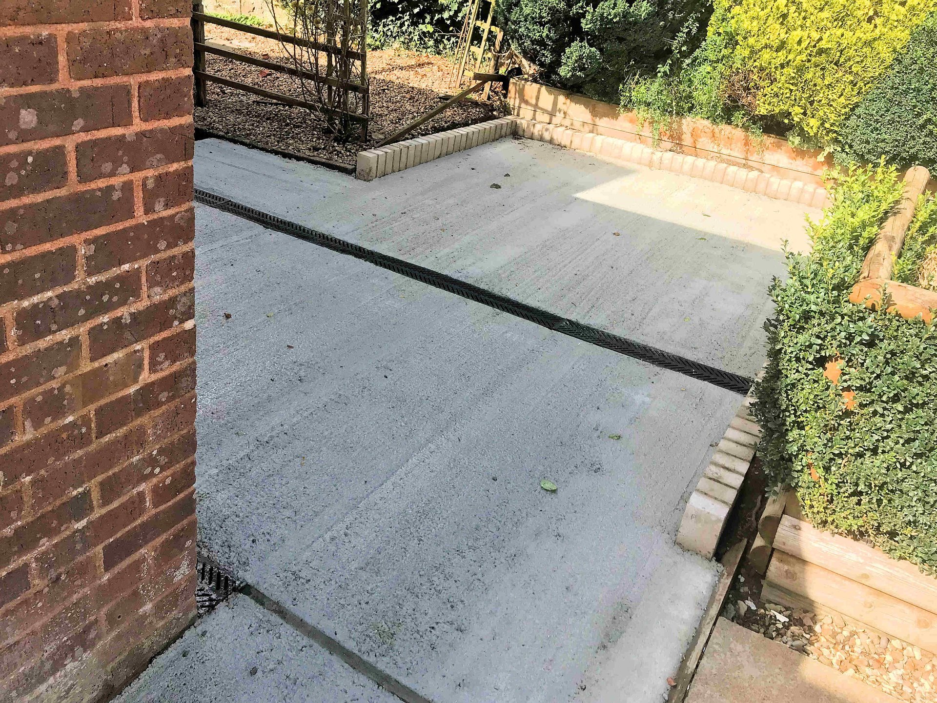 New concrete level hard standing completed to enable access to the garden for wheelchair users. North Devon