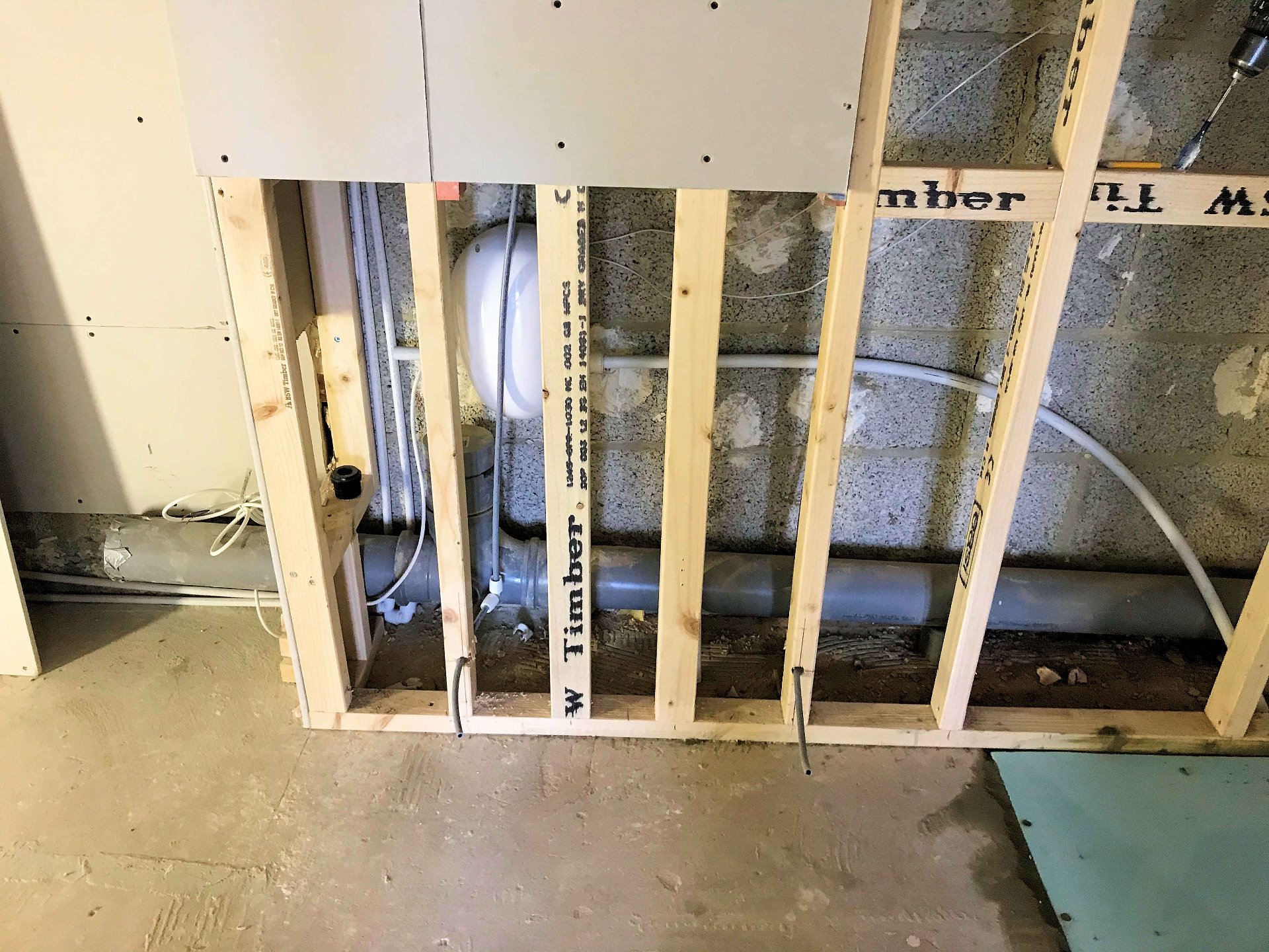 Install hidden shower waste pump. Wet Room North Devon