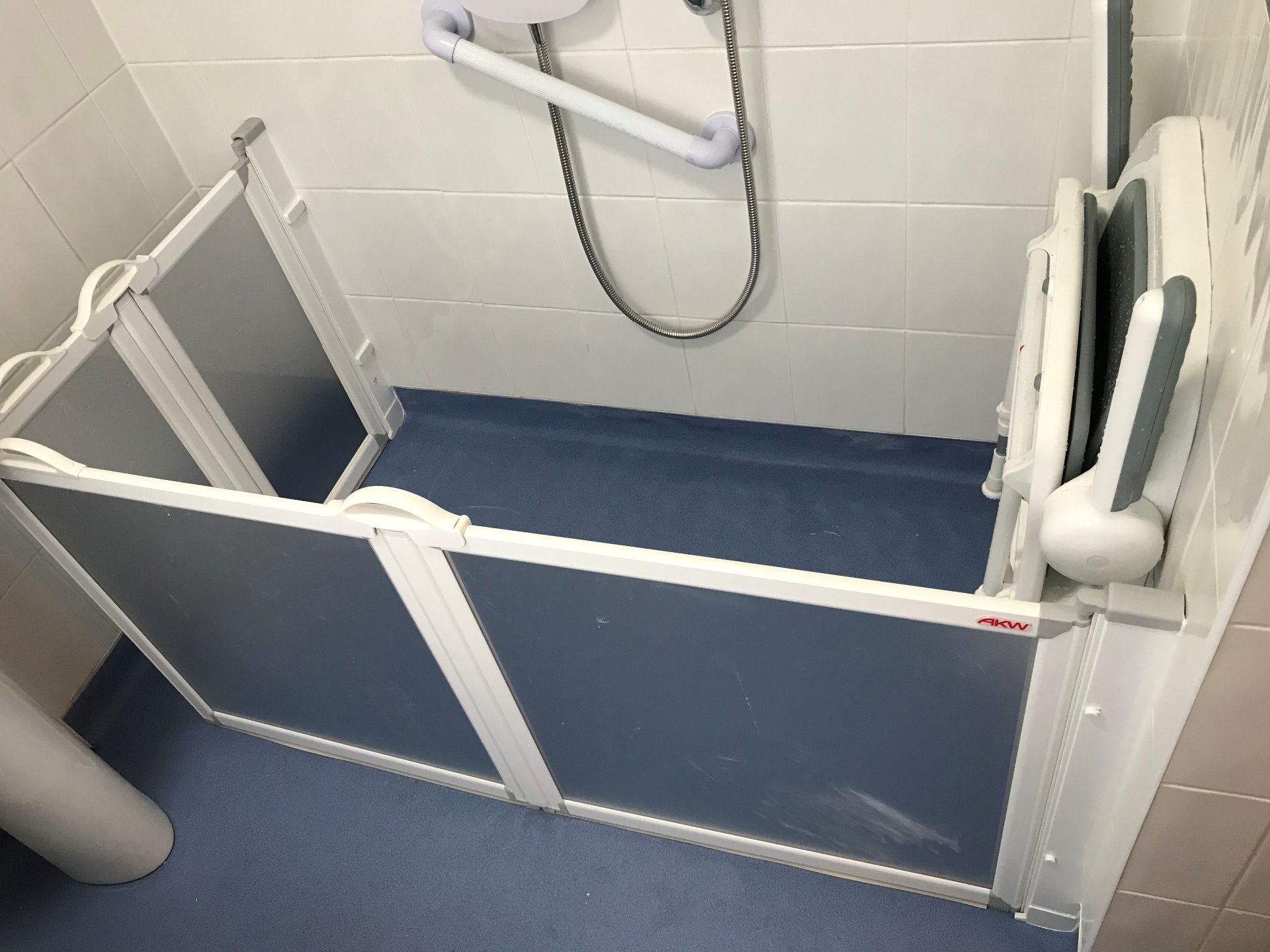 Level access shower area with a fold down seat and carer screens when required, Barnstaple North Devon