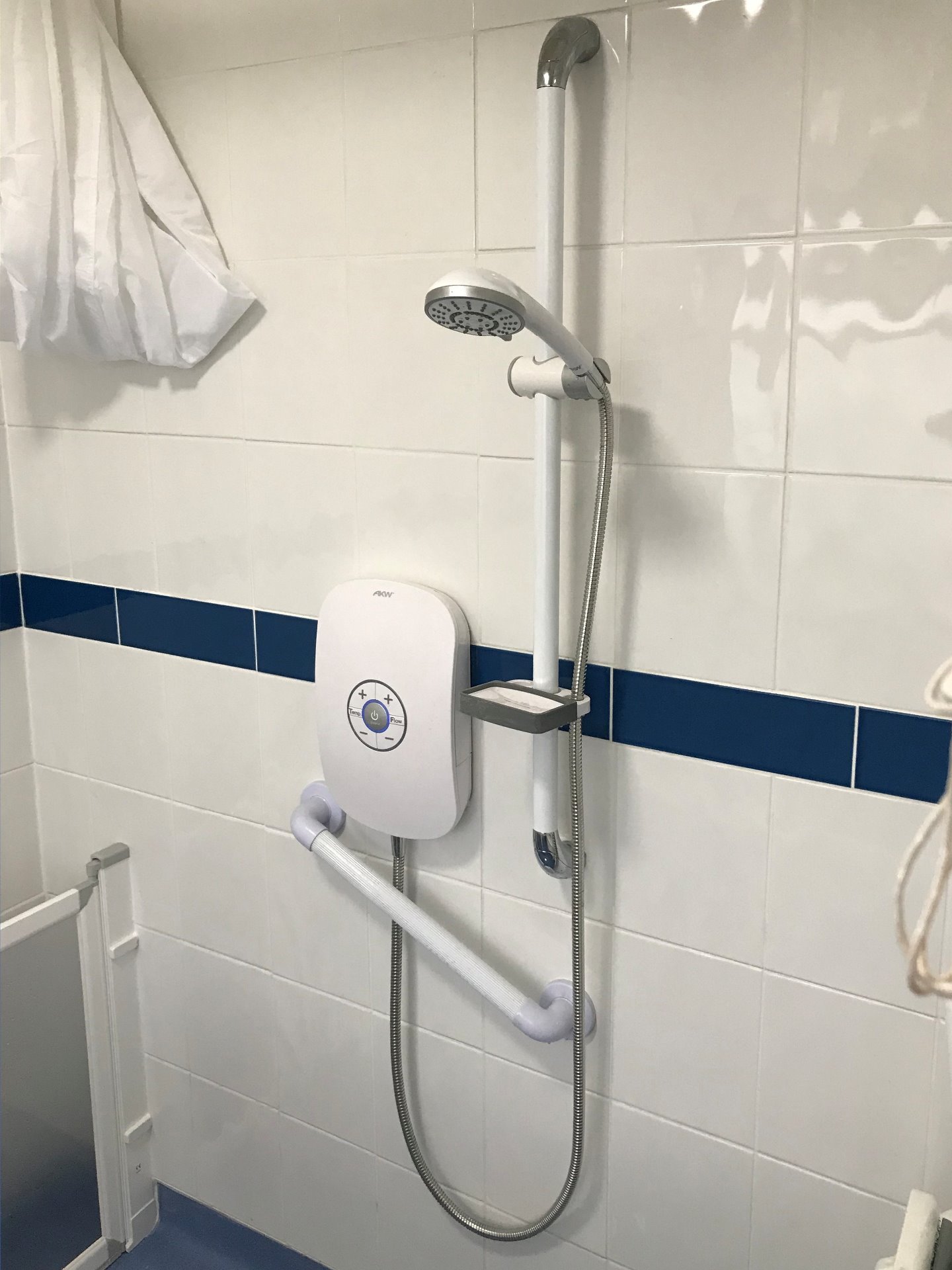 Easy access shower, with convenient grab handles, shower curtain to suit wash area, Barnstaple North Devon