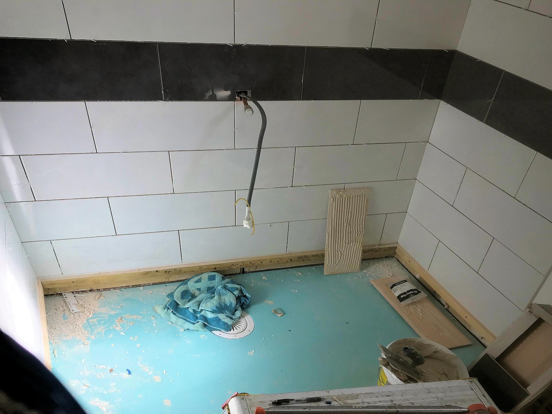 Level access shower room floor installation with central drainage point, Barnstaple North Devon