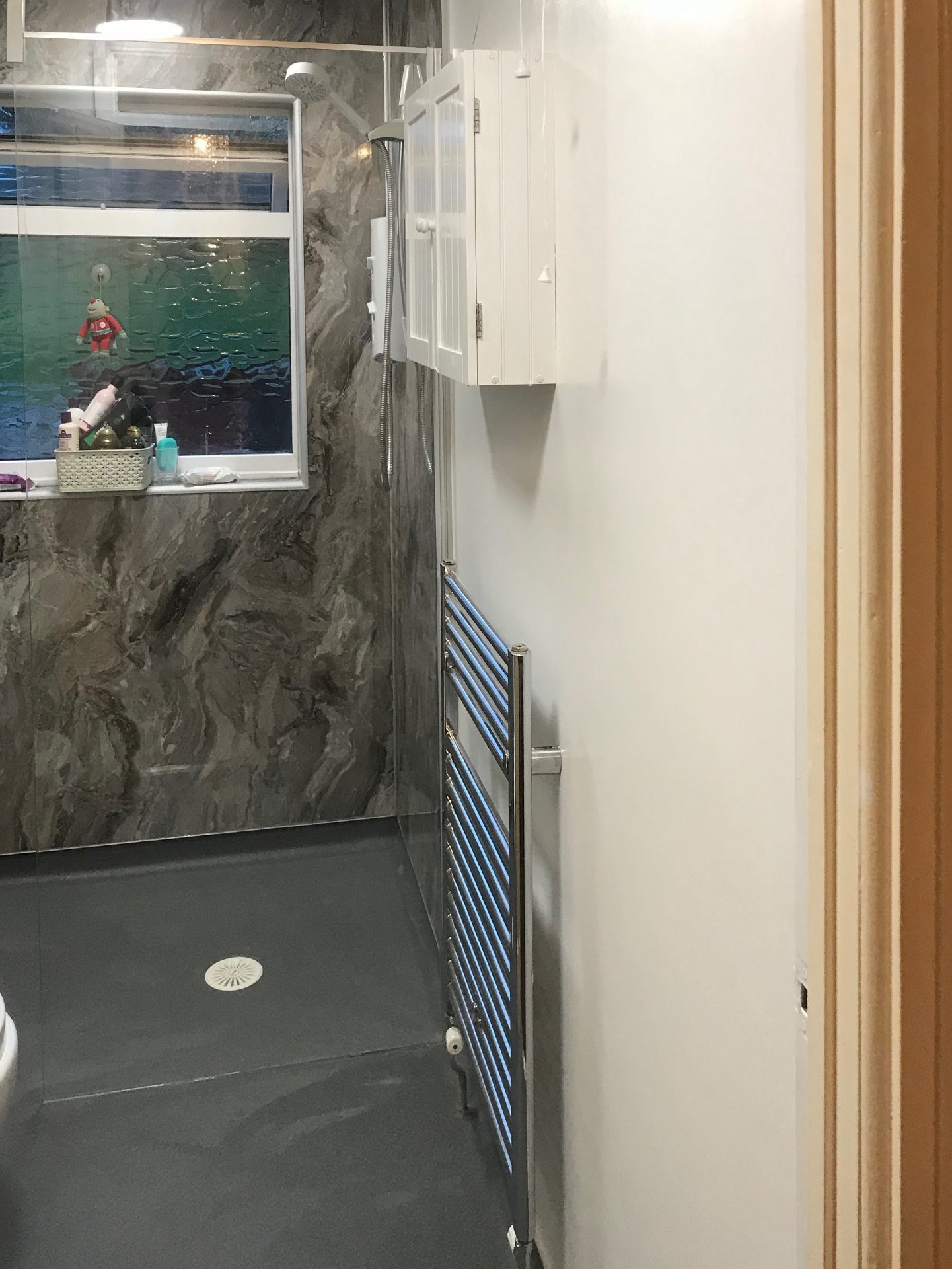 Bathroom to walk in shower room, chrome towel rail radiator. Barnstaple North Devon