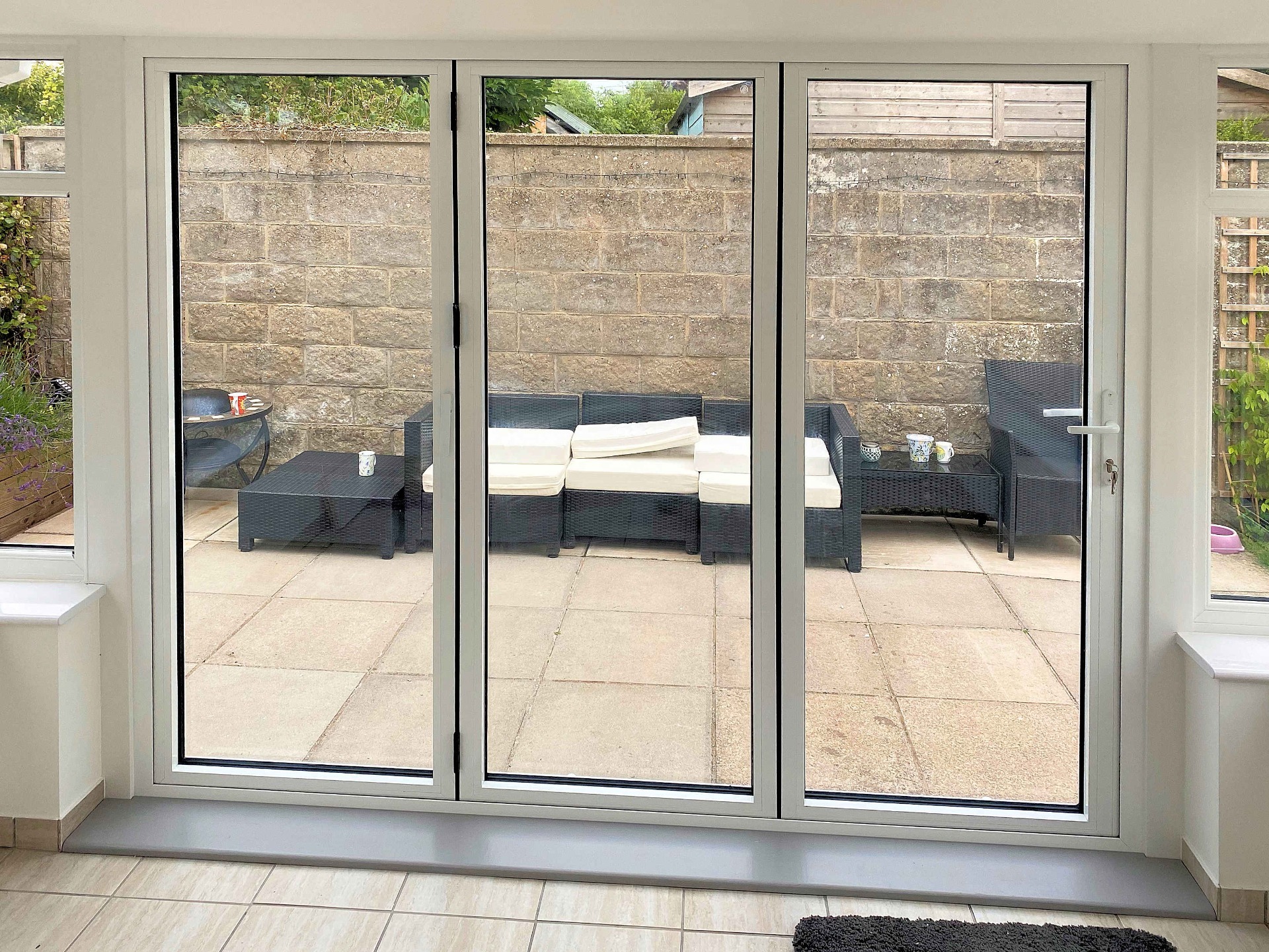New outlook to patio through completed bifold doors. Conservatory. Barnstaple North Devon